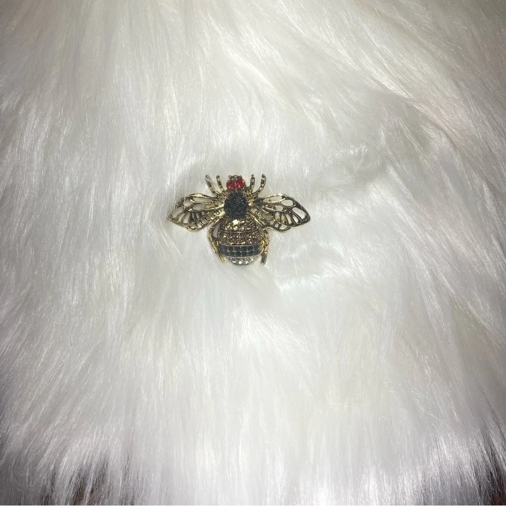 Bee Brooch.Colorful and embellished bumble bee brooch from Aratta.About 1.5”‎ L.